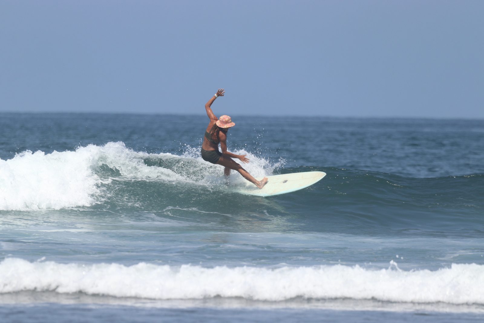 Jordan mid-turn on a longboard at La Saladita